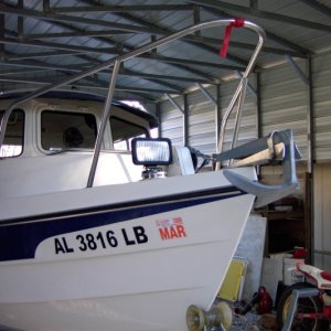 Stick magnetic base light where you need it. Wire runs thru deck pipe. $11. Hang from underneath anchor for a no glare light.