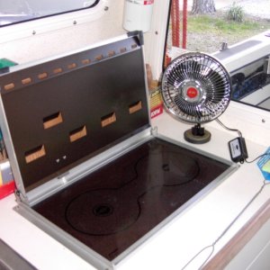 Cheap two speed oscillating fan. Heavy speaker magnet base. It'll stay just about anywhere.