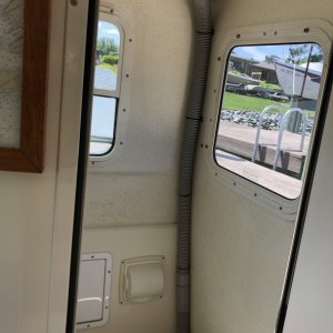 Hose mounted to aft outboard corner with \"Weld Mount\" bonded wire tie system