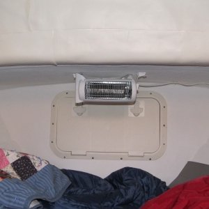 Ceiling mounted heater helps keep the v-berth toasty in the winter when shore power is available.