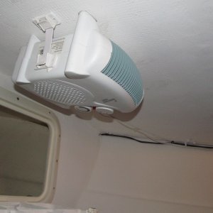 Ceiling heater second view.  Its a table top model and I hung it with 5200 and RV appliance straps.  Solid for 1.5 years now.