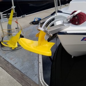 We just put on a Rocna Vulcan 25 in place of our old roll bar Rocna 22 the shorter shank pulls up tight on the roller and like the old Spade we loved on our big sailboat it has a weighted tip and if is anything like the Spade it will have a neck snapping set. We also changed over the gypsy to take the 50' of 5/16 g4 chain and 200' of 9/16 8 braid nylon off the Ranger Tug, we have seen gusts at times in the Sea of Cortez in the 85 mph range and one night in Lake Mead when the wind never dropped below 35-45 knots, in a small cove 15 feet off the lee shore rocks. We have seen a good sized sailboat go on the rocks behind us so we are happy to have always been "over anchored " Our Spade was yellow and easy to see on the bottom, always copy that now.