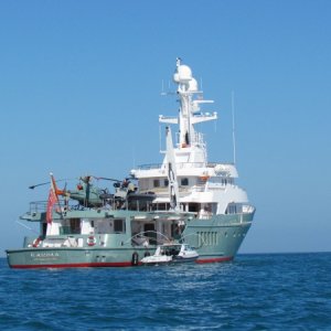Check out this Yacht anchored just outside Key WEst Harbor, I think I see a helicopter and a ultra sized hard bottom inflatable. A pretty sturdy looking deck crane to boot.