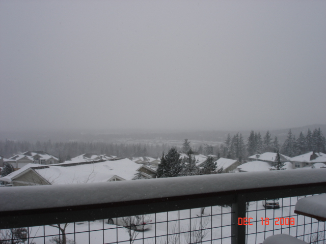 18 December Bellingham 
Looking northwest. Wind is 
picking up and blowing 
the snow off of the rooftops.