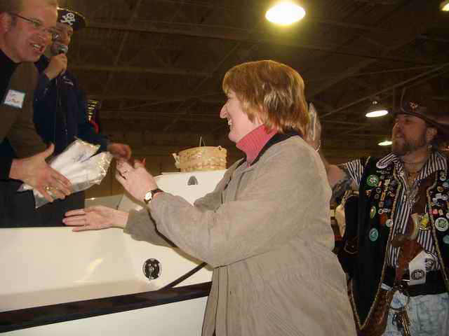 20070127 - 11 Seattle Potluck & Factory Party - Tom Latham giving Amy T shirts