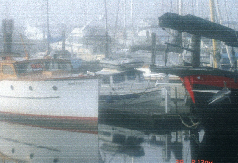 29 Sept 2006:  Tucked in between the bigger boats on a foggy morning in Port Townsend.