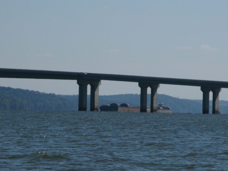A barge moored just up river of the bridge.