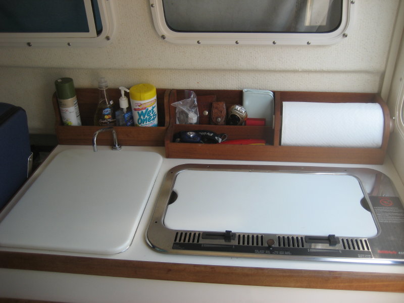 Additional galley storage racks and PVC sink and stove covers.