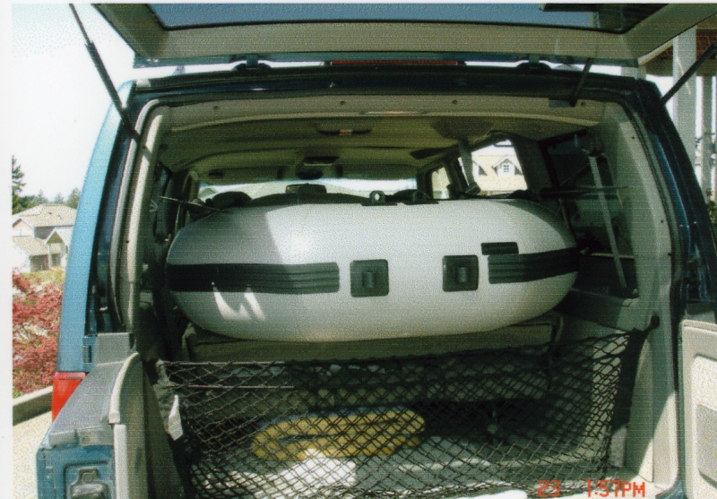 April 2006: Laid the seats down in the Astro Van & slid the dinghy in. Great fit!