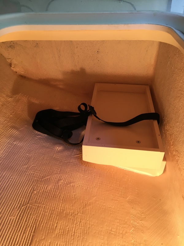 Battery holder below V-berth
