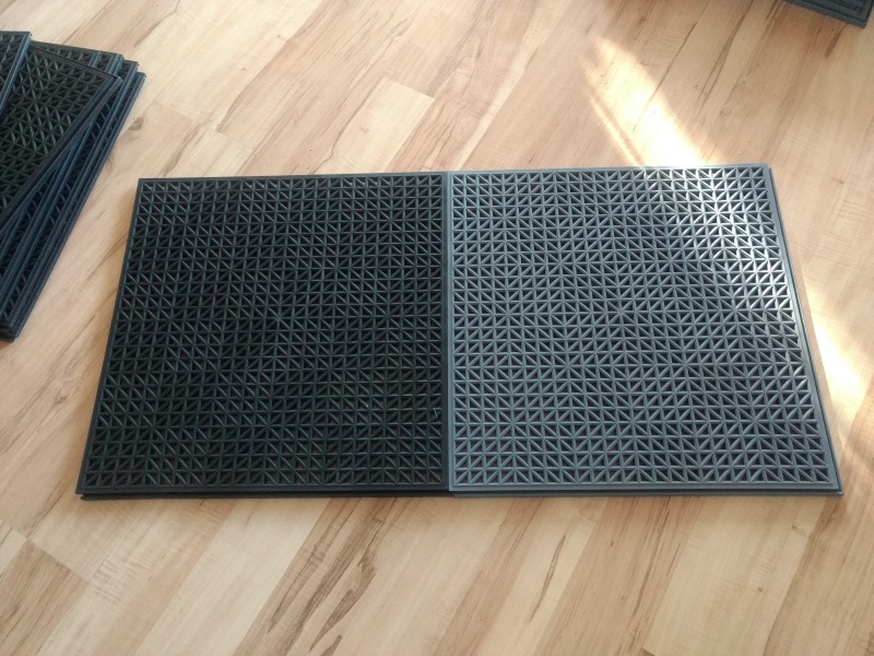 Bought some garage floor tiles from Costco. Choices were all black or gray/black.

I"m hoping this will help keep the feet clean and dry.