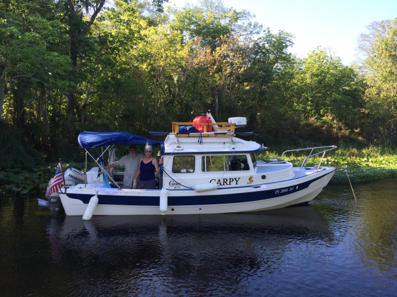 Carpy, owners Bruce and the \"other\" Joyce, :-), setting up camp on the Wekiva River.