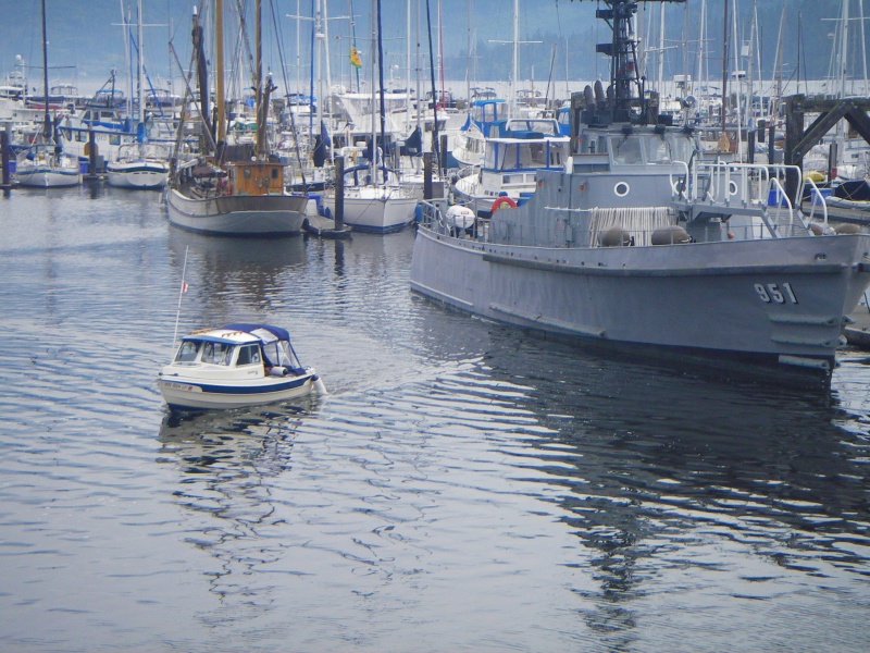 Catman's Bambina "doing what he can, just because he can", cruising out past the "Olympic Venture" an active duty Navy tender moored "mostly" at JWM.