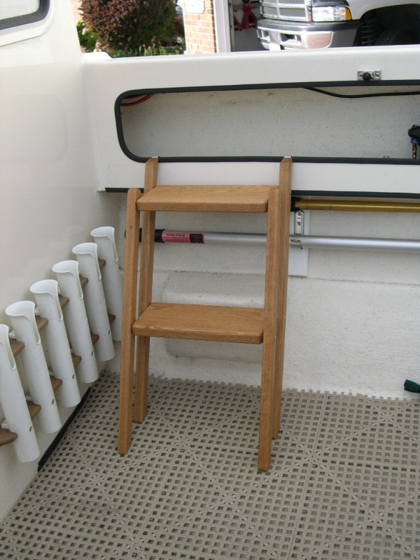 (CAVU) Steps hooked over the lower shelf edge ready for use on either side.
