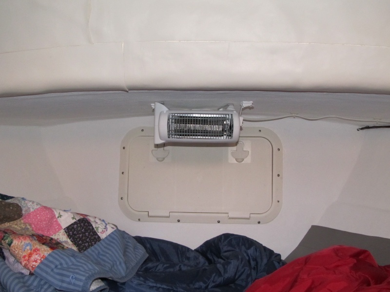 Ceiling mounted heater helps keep the v-berth toasty in the winter when shore power is available.