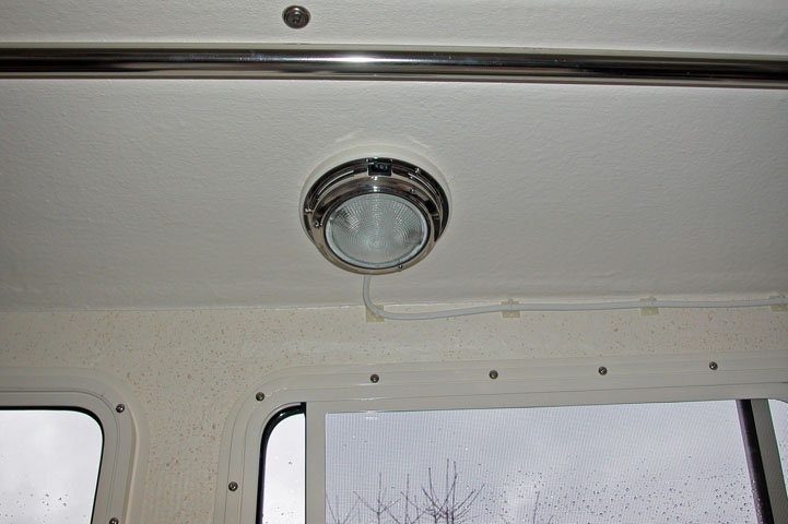 Completed overhead light.  Has two brightness levels.  Highest is good enough to conduct surgeries under!  It is very bright.