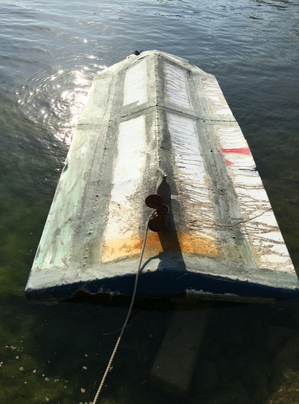 Cuban refugees came over in this overturned homemade: not a C Dory! We found this floating offshore near Plantation Key; 3 bladed prop has 2 blades for smooth ride.