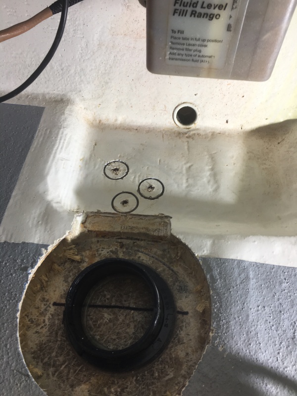 Cutting out the 3 screw holes for the bilge pump mount to screw into solid resin.