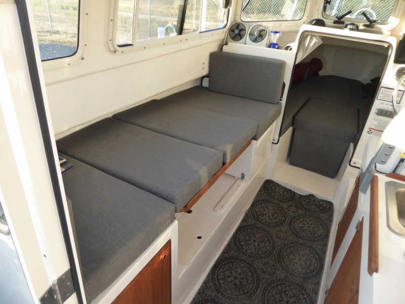 Dinette berth with factory-provided standard cushions.
