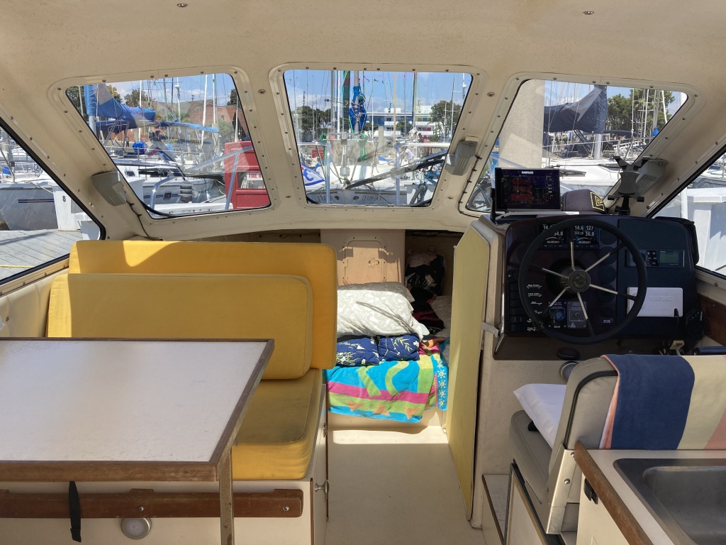 dinette / helm/ full queen bed with storage below