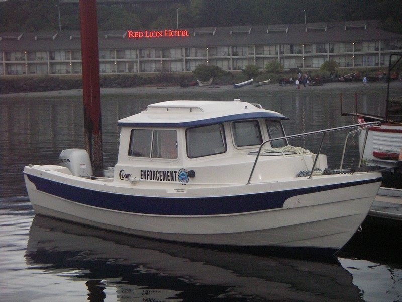 "Enforcement" came in with the Indian canoes.  It's a support boat traveling with the "Tribal Journey -07"