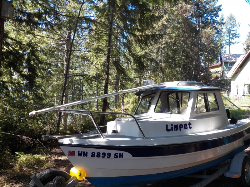 Four 10 foot lengths of PVC pipe laid between the cabin top hand hold and the "bump" in the CD 16 cabin top.