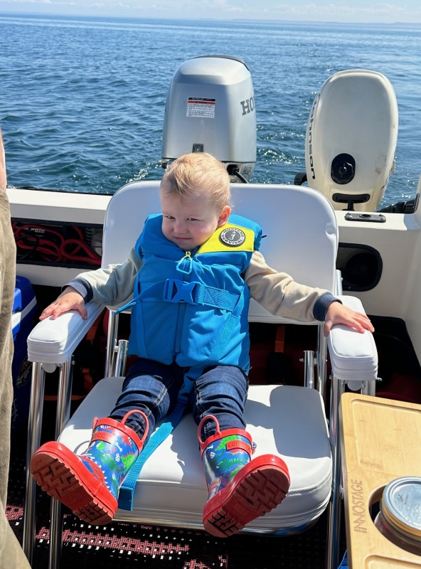 Grandson enjoying a sunny day cruise!