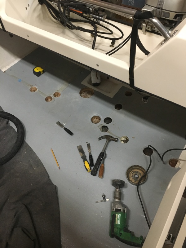 Had water intrusion into the balsa core where the gas tank brackets were screwed in so I drilled those areas out with a hole saw.