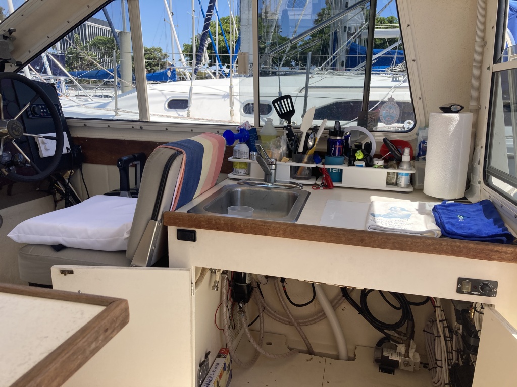 helm / galley with storage - hot water heater removed for max space (plumbing is still intact)  we use JetBoil Genesis system