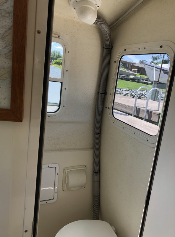 Hose mounted to aft outboard corner with \"Weld Mount\" bonded wire tie system