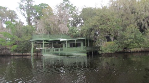 House with a boat lift many along the river