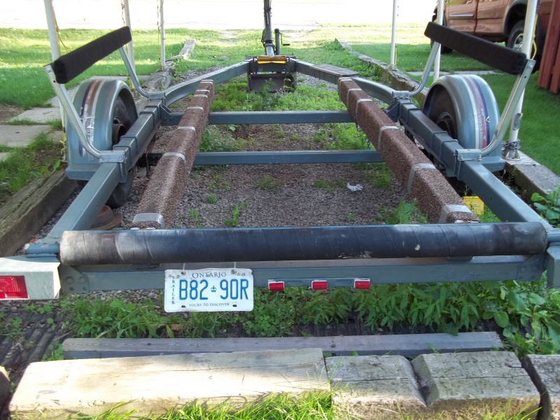 July 29/11...1987 EZ-Loader trailer with aft roller...the information stamped on the roller was..Lawrence 4" Marine Wet Exhaust..SAE J2006R1   1998