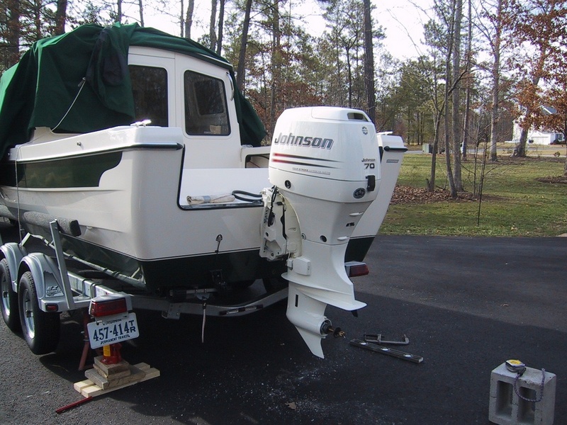 Late in the after noon, we have it bolted up right where we wanted it, with the ventilation plate 1/8" below the bottom of the boat. Thanks family for helping me do a job well done.