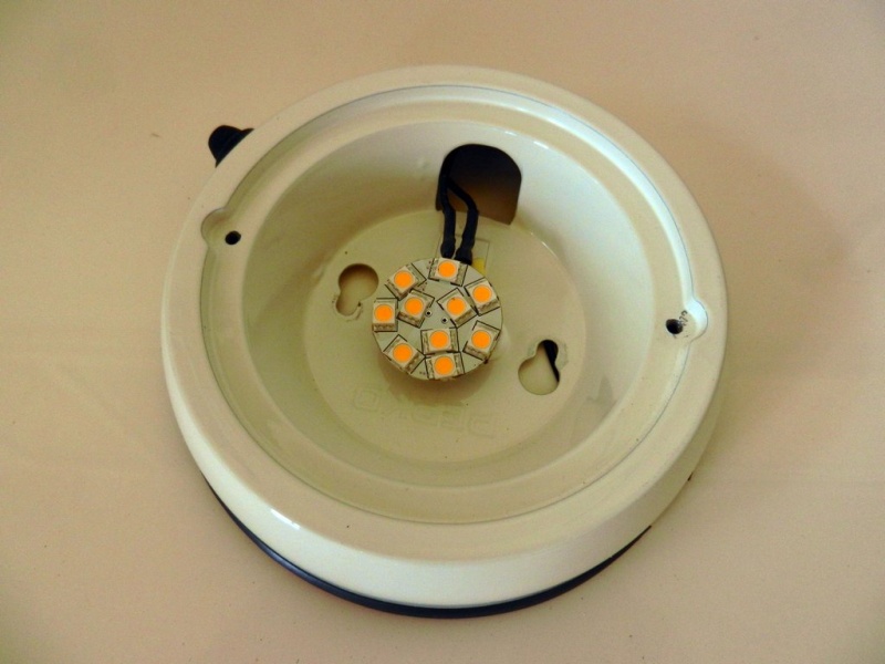 LED "puck" glued to old housing, wires routed to existing switch