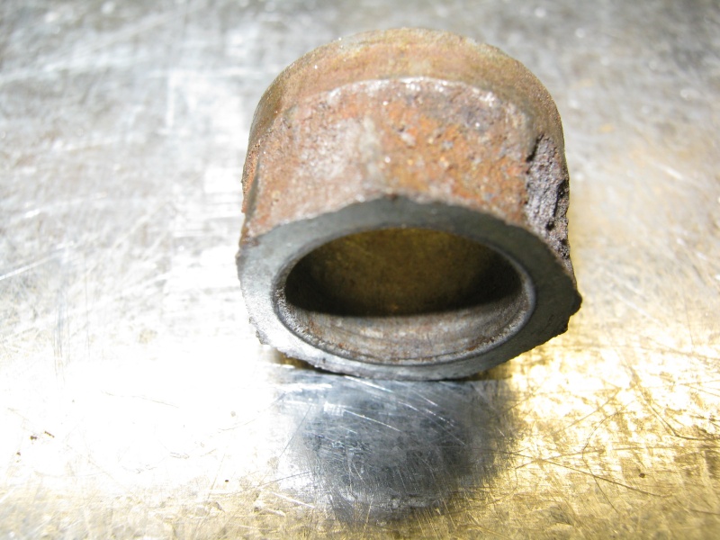 Lip of bushing sheered off under load.