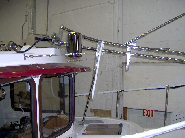 mast tilting forward. It can now be put up standing on the front deck