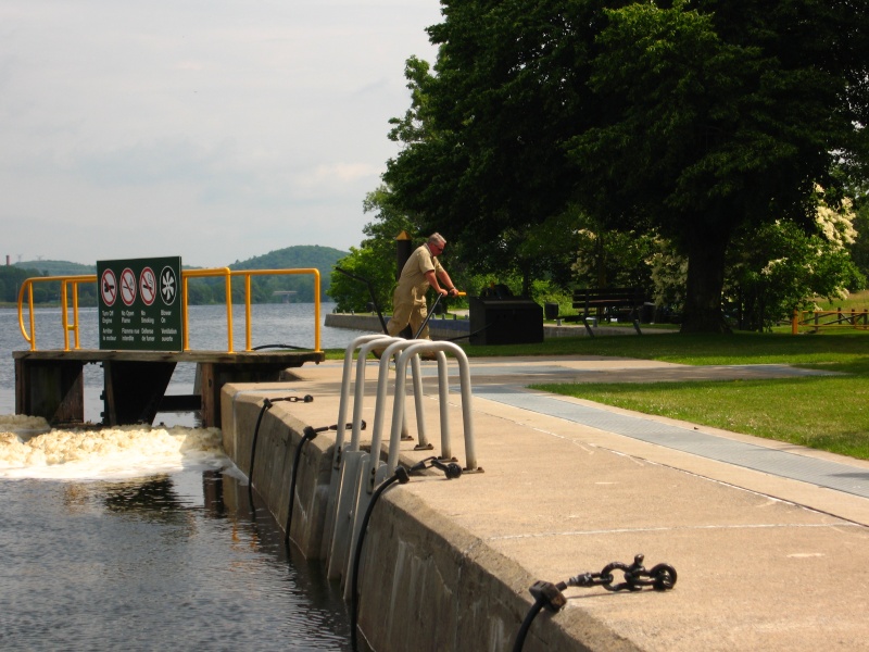 Most of the locks on the Trent Severn are run manually, the Lockmaster is turning the handles to open the lock door