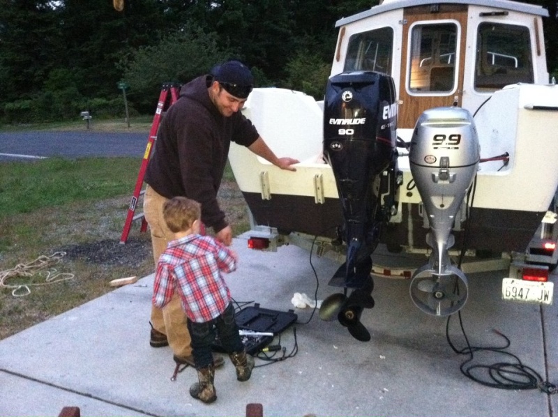 my son helping me on fathers day work on boat