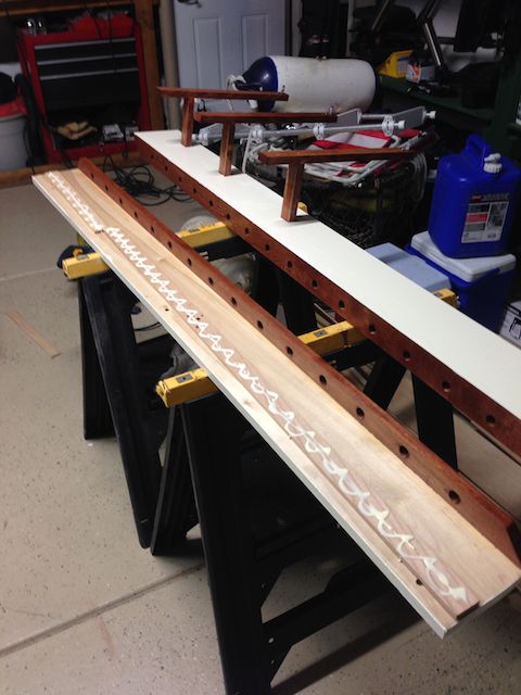 New ceiling shelves.  Without shims, shelves angled slightly up and did not sit flat.  I glued shims above the three mounting holes which fixed the problem.