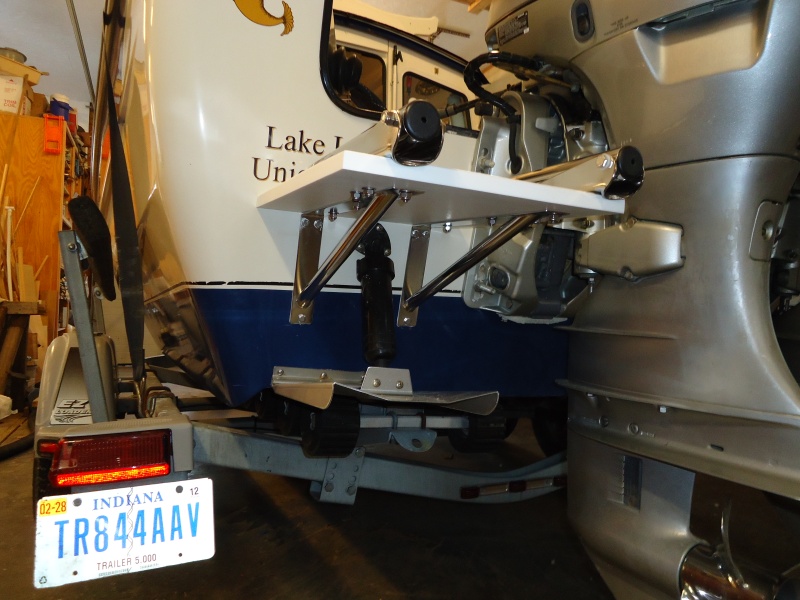 Off the shelf brackets and a piece of starboard.