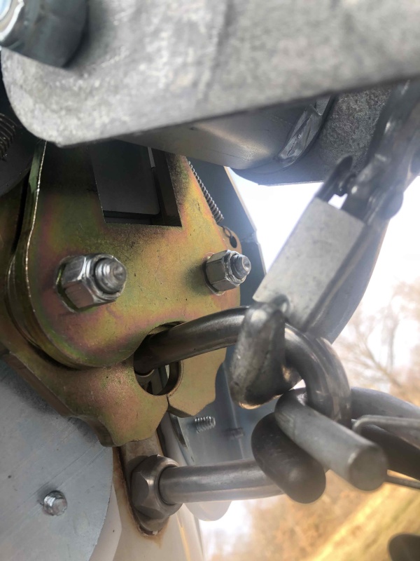 Photo from below shows the latch closed around towing eye on boat.