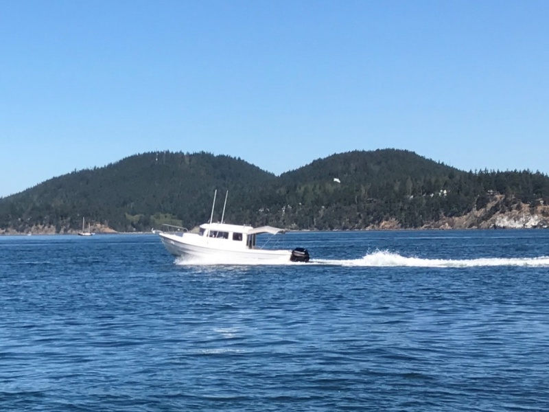Photo of Big-C caught by Sean (C-Brat member "spd") running alongside in his Venture 23 on our way to Anacortes! On this trip we had a boat load of 4 full grown men, so running pretty heavy!
