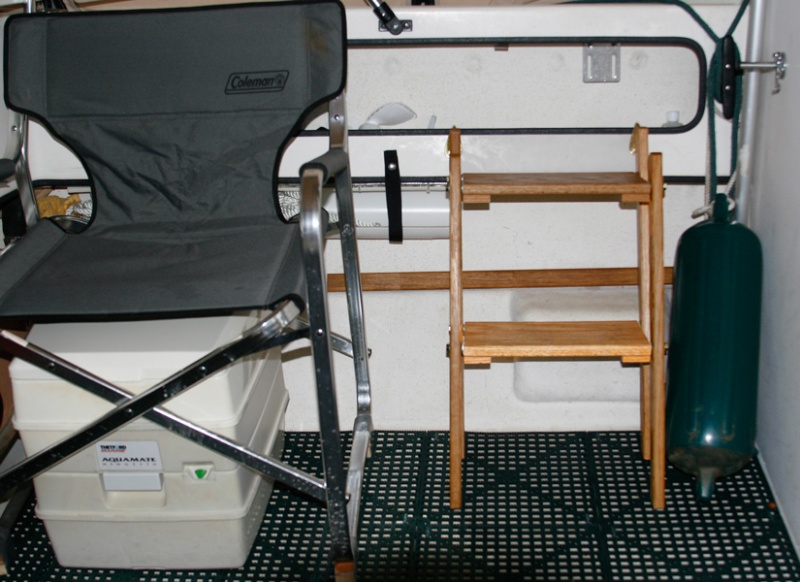 Port Cockpit updated with brass boarding ladder hooks, new dri dek and teak trim strip.