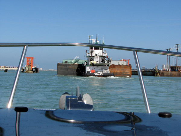 Running through the swingbridge behind a tug/barge