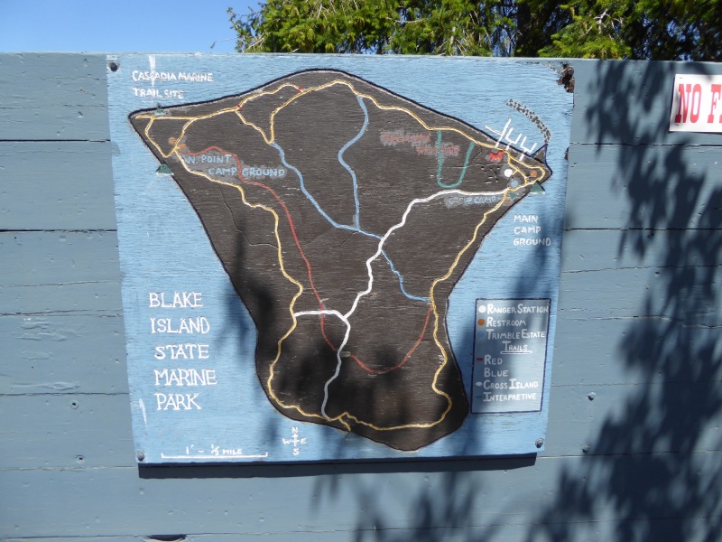 Setting out to hike around the island, trail map posted by the marina.