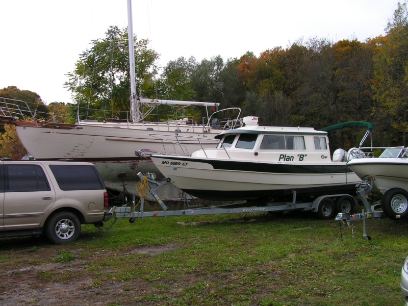 (Stanley-J) Sirena, our Tayana 37 in background prior to hull painting with our new C-Dory 25 "Plan-B".  10/05