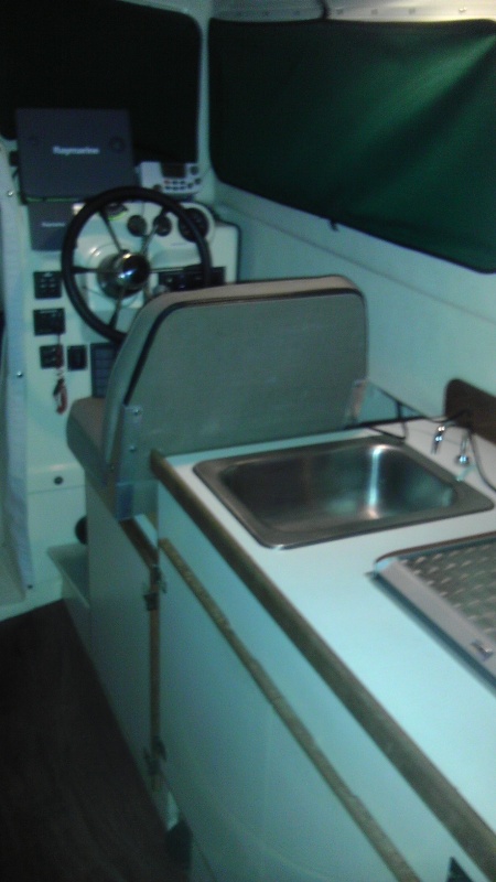 Starboard Helm, Flip forward Helm Chair, Stainless sink, Wallas Ceramic two burner stove top,