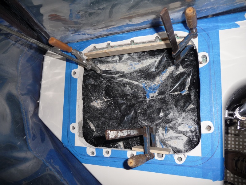 Starboard temporary wood form clampted in place and ready for thickened apoxy.