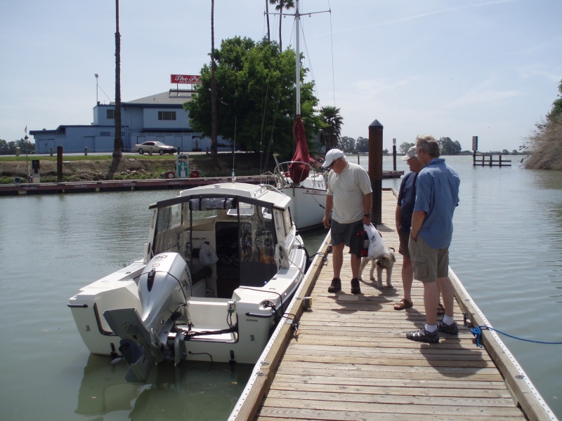Steve Grover (Tee Ten) and Sidney (dog), Joel and Steve (SeaSpray) checking out Tee Ten.