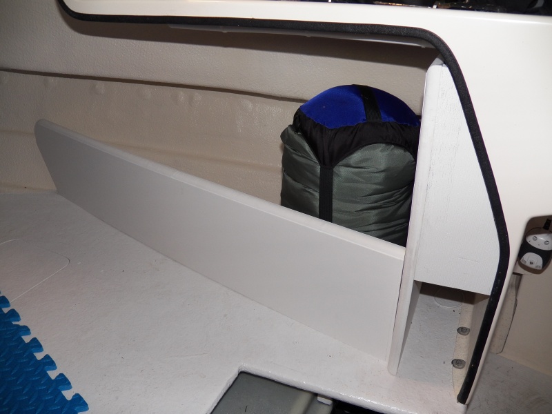 Storage is an issue, so I used the rest of the Azek board to make a storage cubby in the V berth.  The little cubby next to the helm is dedicated for a first aid kit and ditch bag.